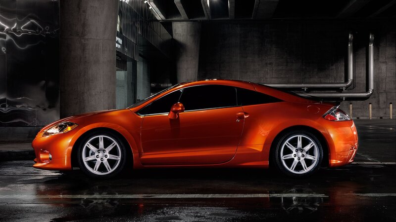 Orange sports car in garage