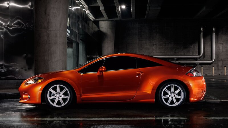 Orange sports car in garage