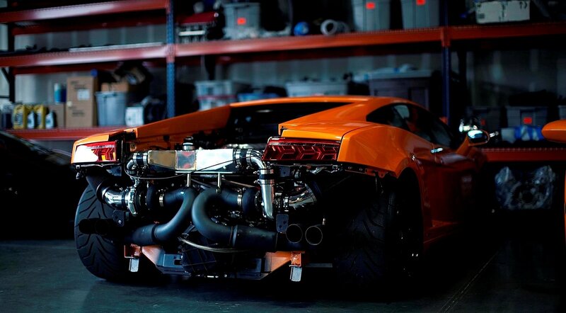 orange sports car in garage