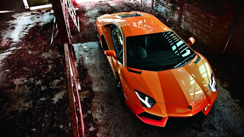 orange sports car in garage