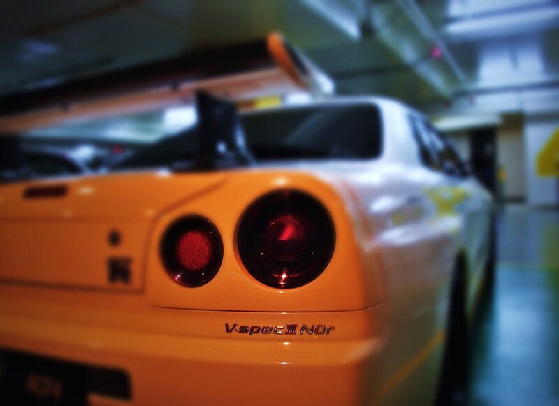 orange sports car in garage