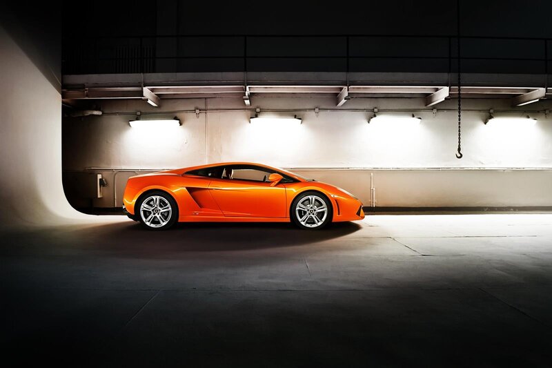 Orange sports car in garage