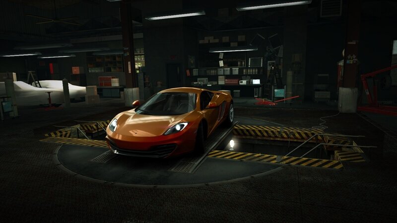 orange sports car in garage