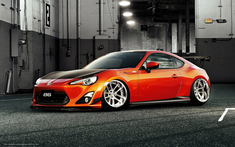 Orange sports car in garage