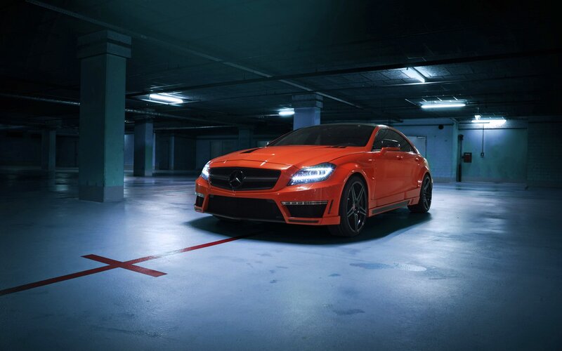 orange sports car in garage