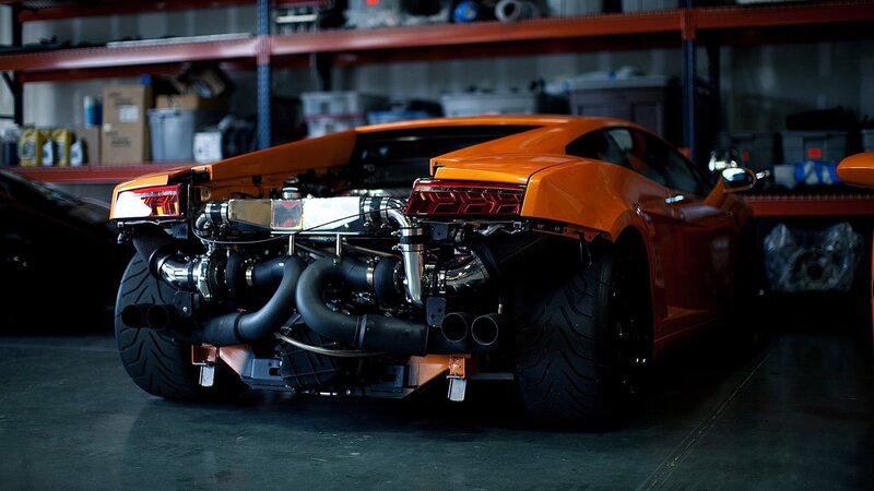 orange sports car in garage