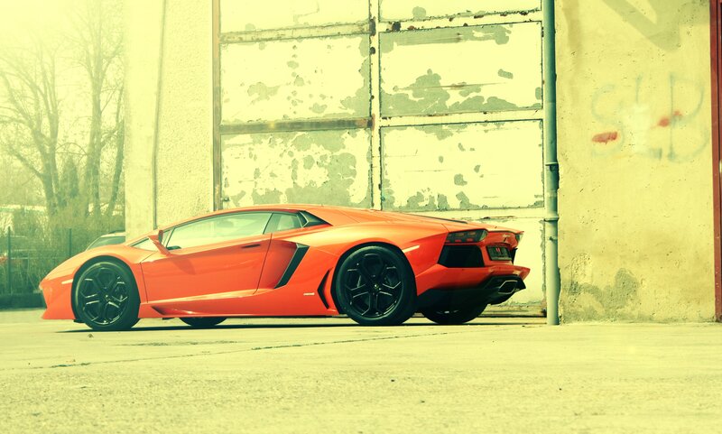 orange sports car in garage