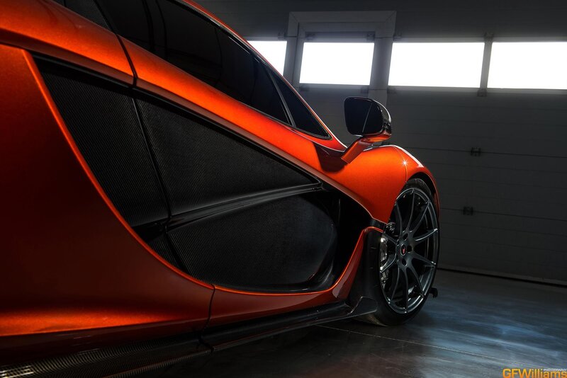 orange sports car in garage