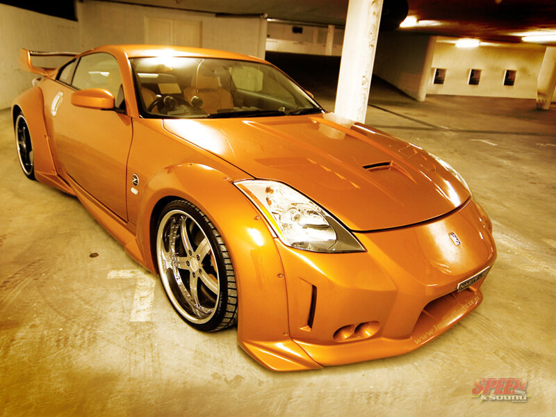 orange sports car in garage