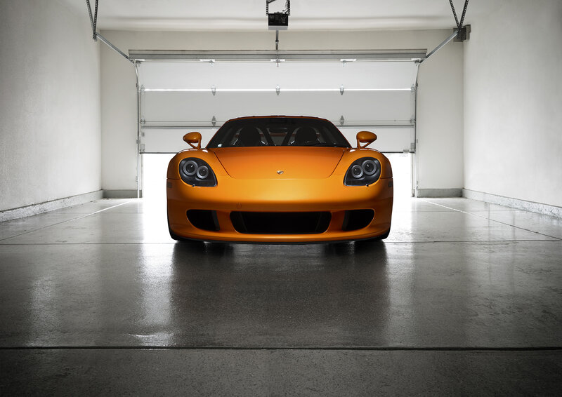 Orange sports car in garage