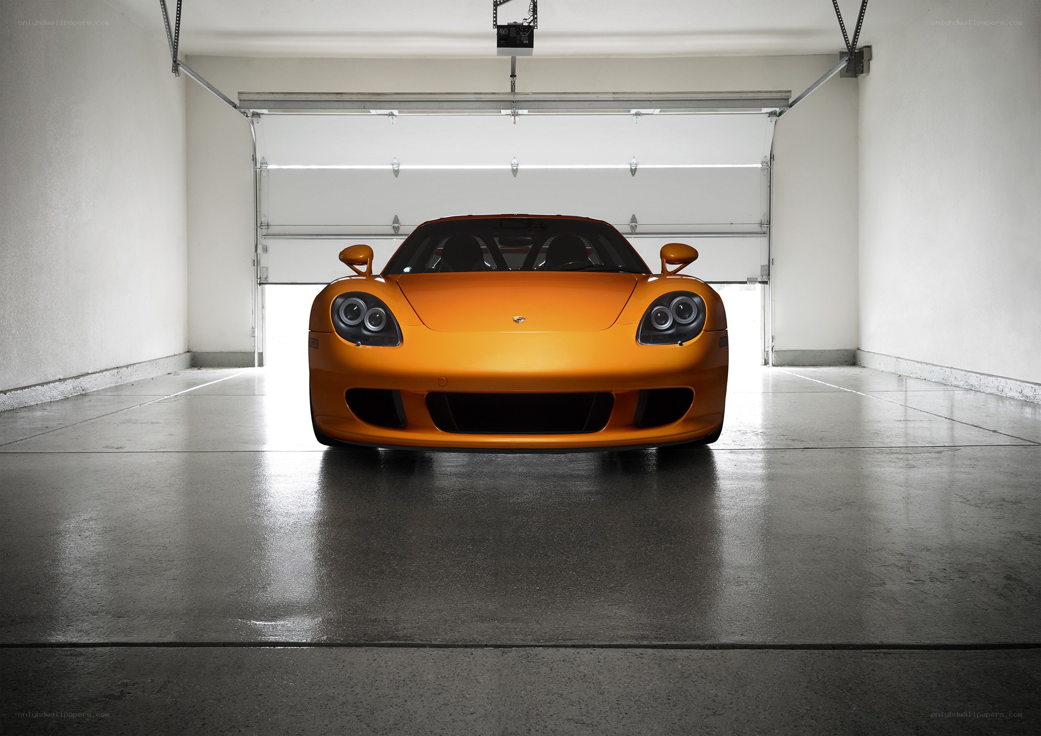 Orange sports car in garage