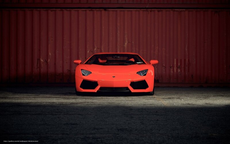 orange sports car in garage
