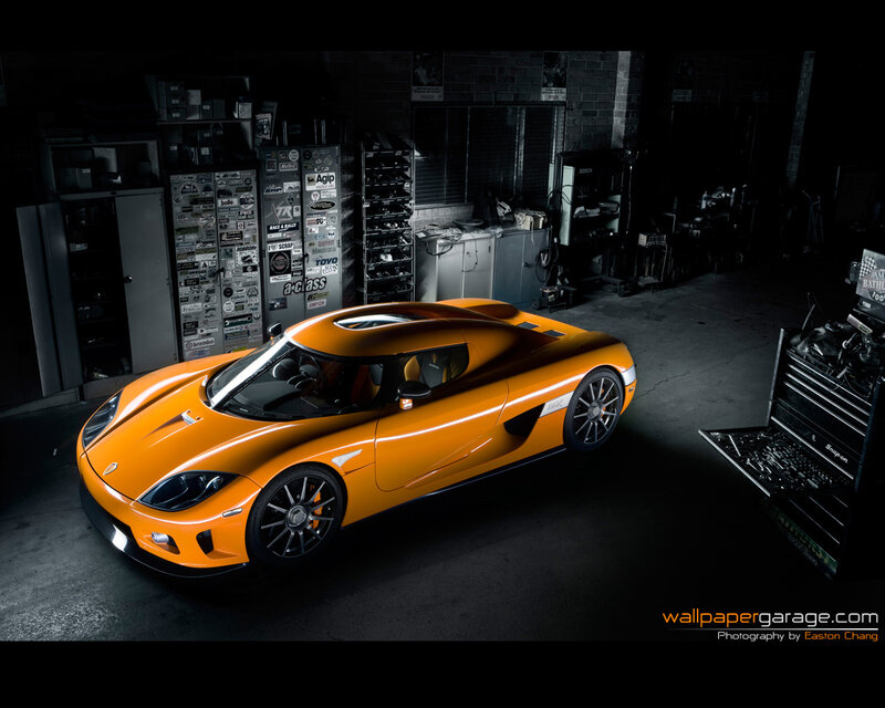 Orange sports car in garage