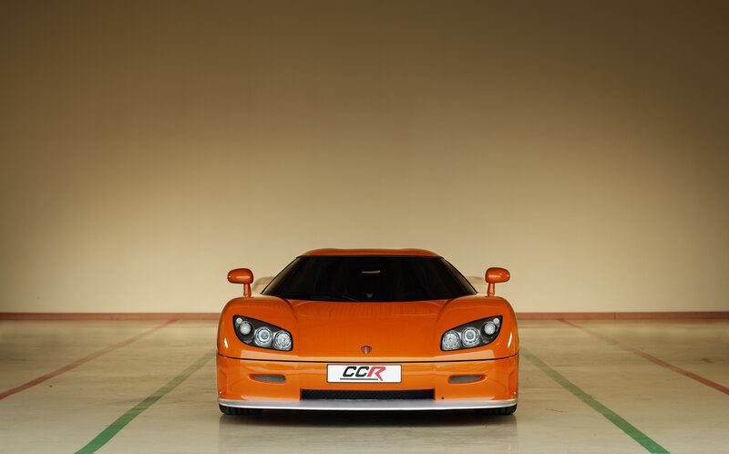 Orange sports car in garage