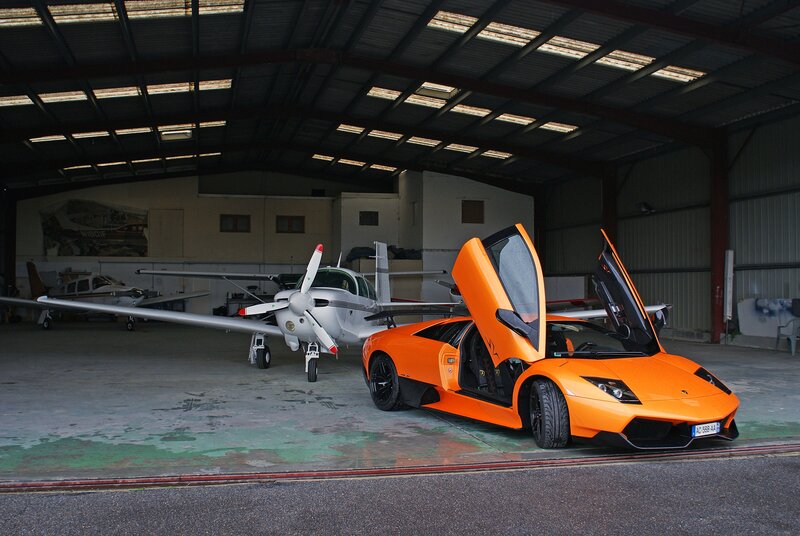 Orange sports car in hangar
