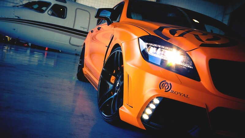 Orange sports car in hangar