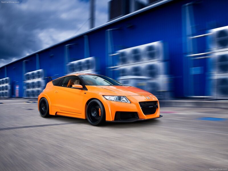 orange sports car in motion