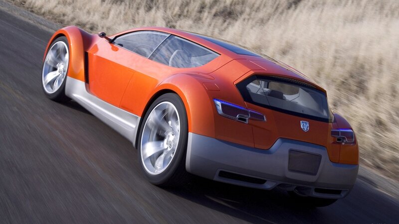 orange sports car in motion