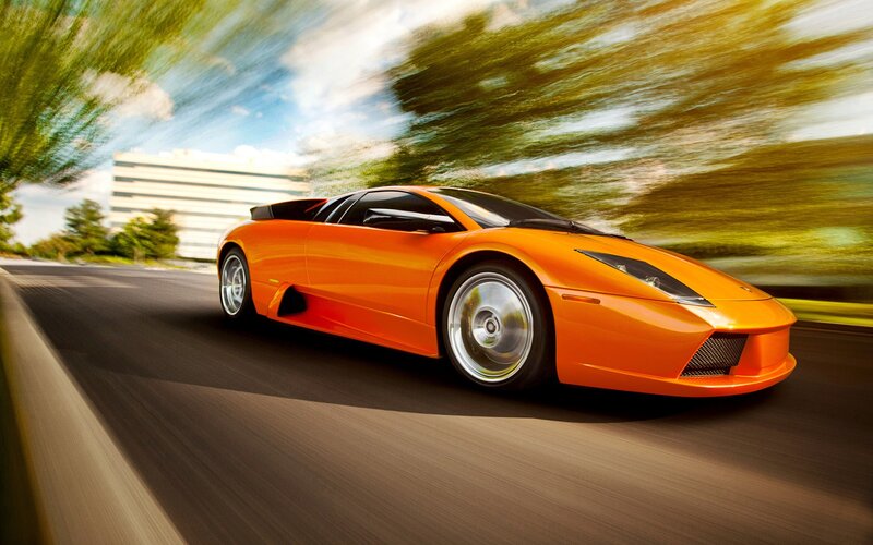 Orange sports car in motion