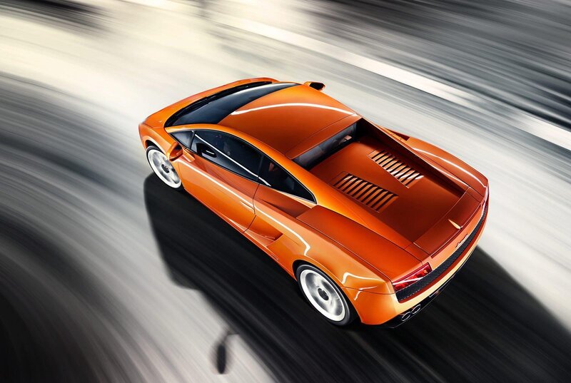 Orange sports car in motion