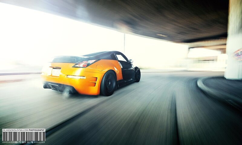 Orange sports car in motion