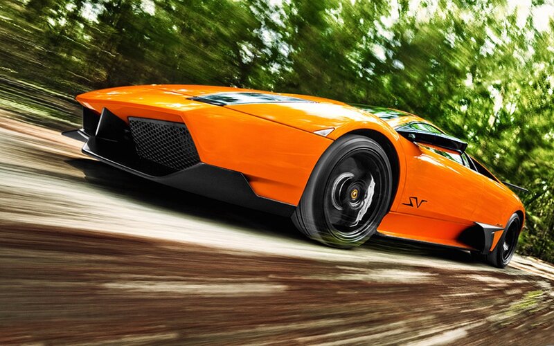 Orange sports car in motion