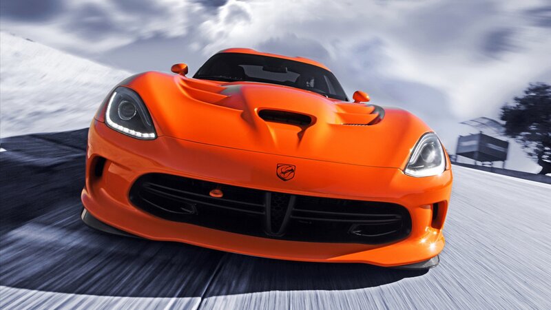 Orange sports car in motion
