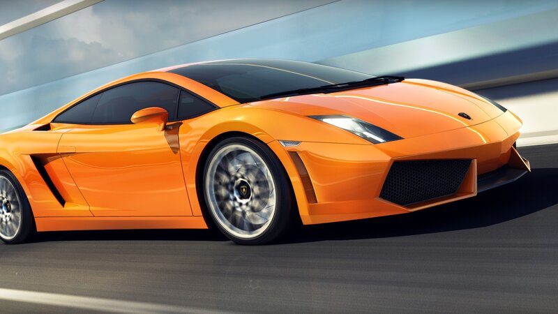 orange sports car in motion