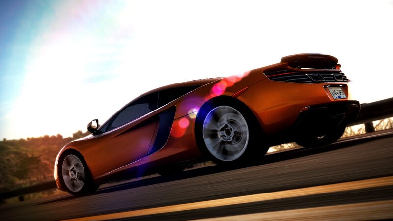 orange sports car in motion