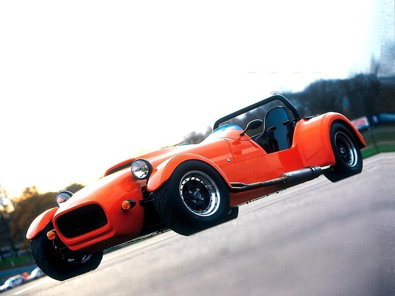 orange sports car in motion