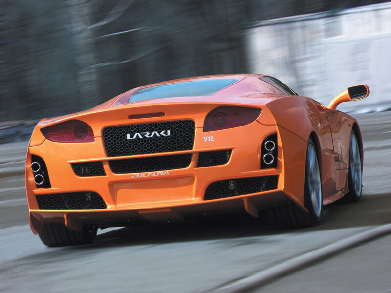 Orange sports car in motion