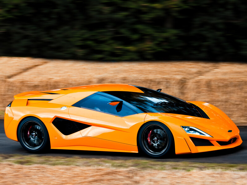 Orange sports car in motion