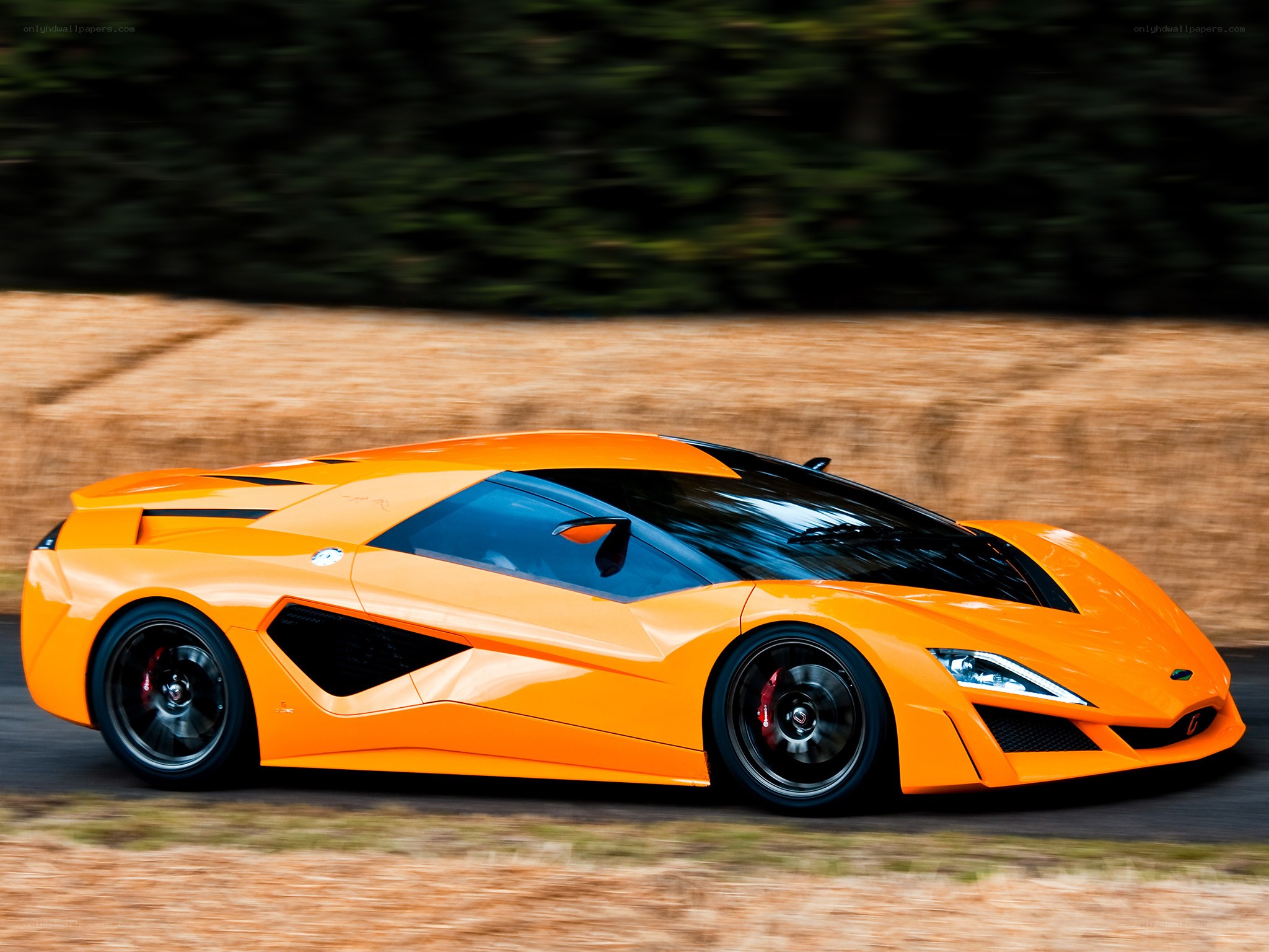 Orange sports car in motion