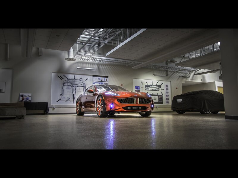 Orange sports car in showroom