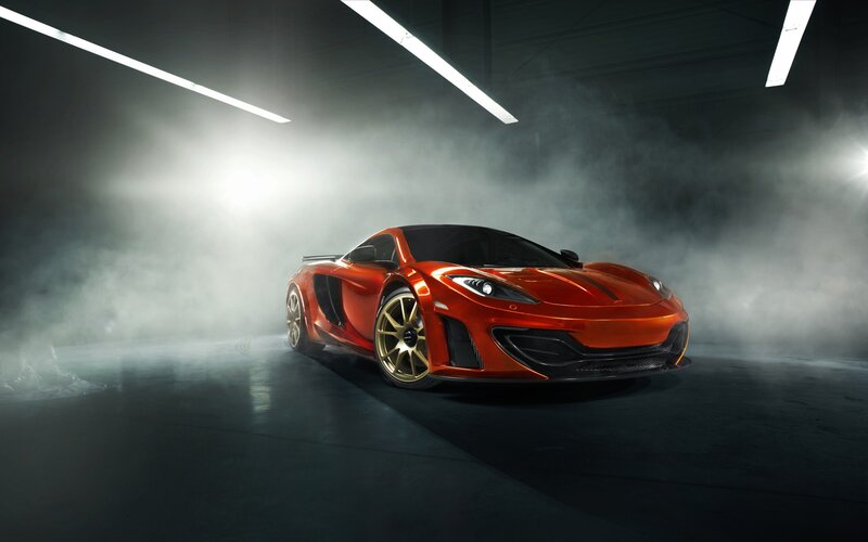 orange sports car in smoke