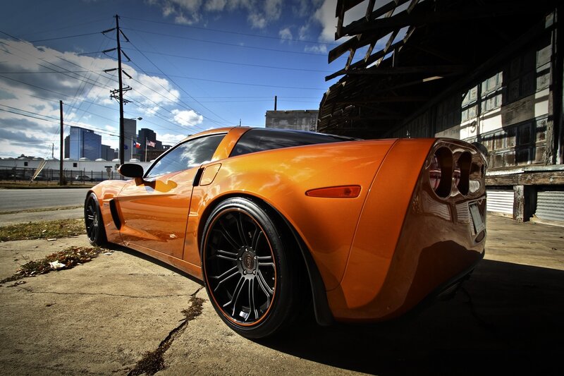 Orange sports car in urban setting