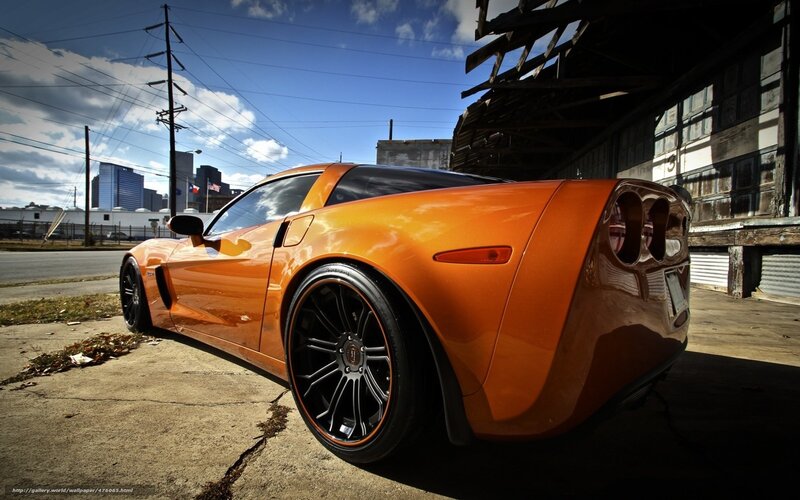 Orange sports car in urban setting
