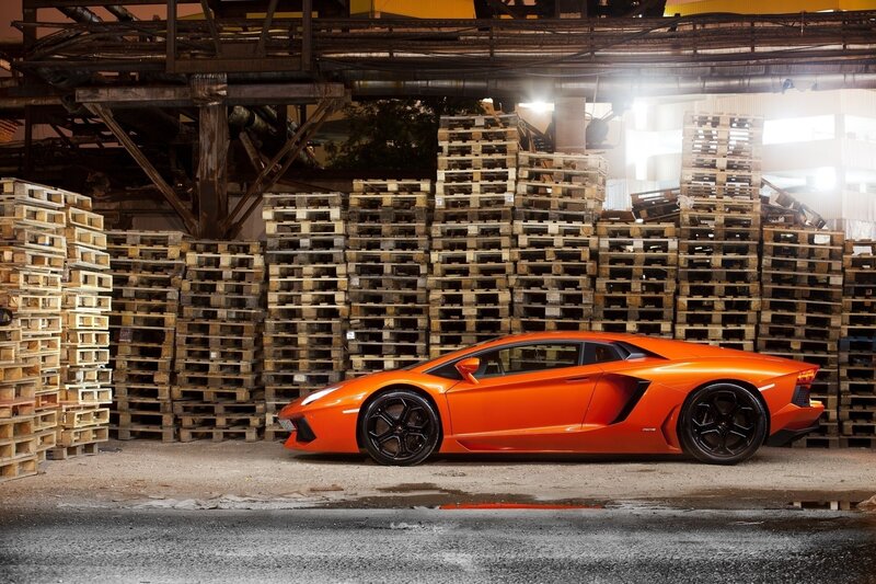 Orange sports car in warehouse