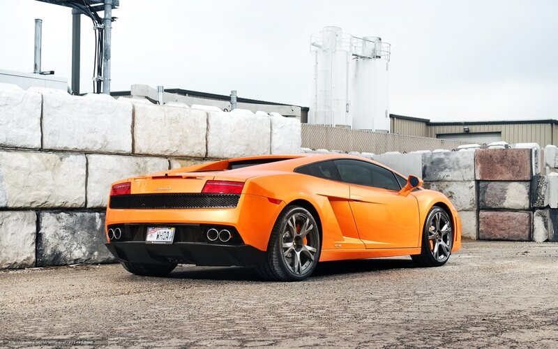 Orange Sports Car — Neutral, Photograph, Concrete Blocks