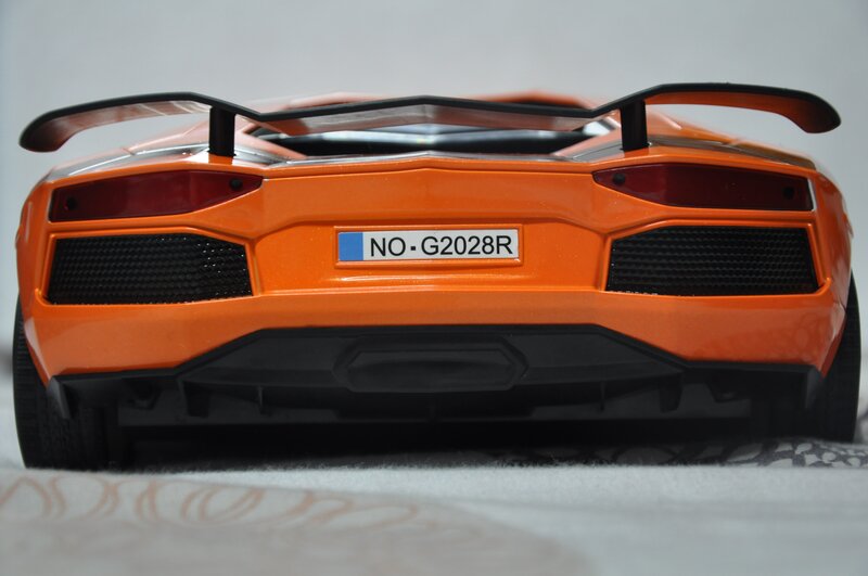 Orange Sports Car — Neutral, Photograph, Rear Wing, License Plate