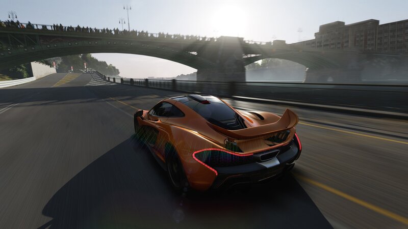 orange sports car on a bridge