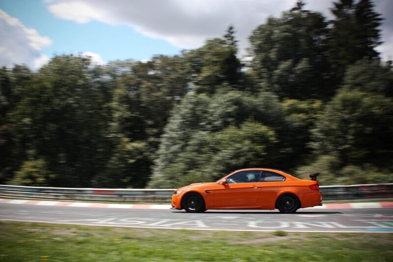 Orange sports car on a racetrack