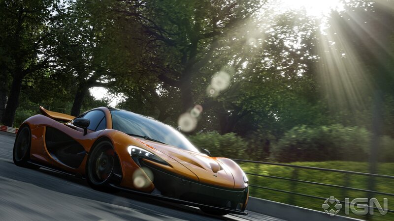 orange sports car on a road