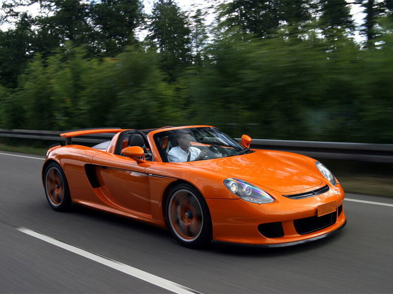 Orange sports car on a road