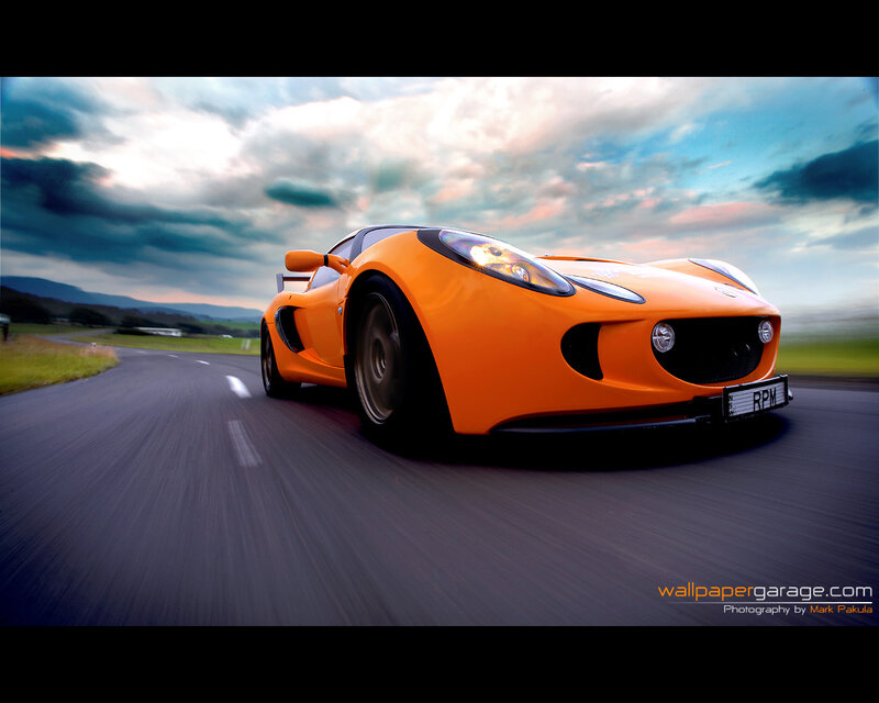 Orange sports car on a road