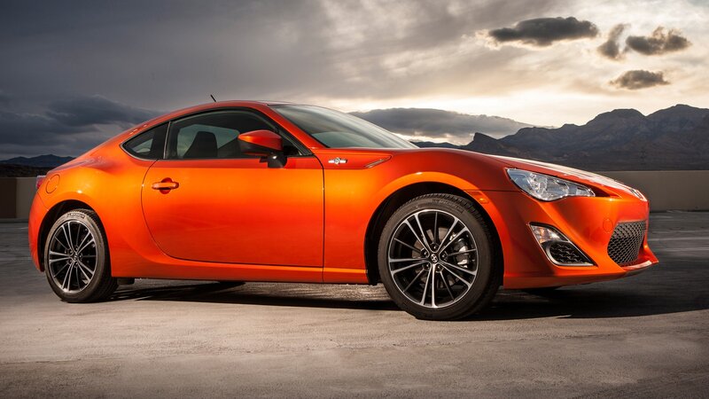 Orange sports car on a road