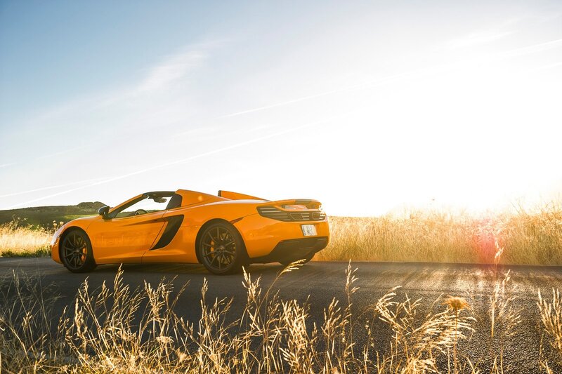 Orange sports car on a road
