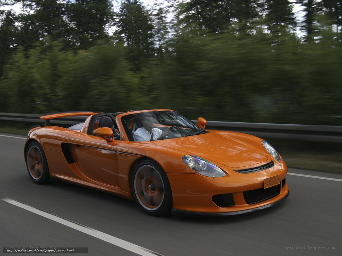 Orange sports car on a road