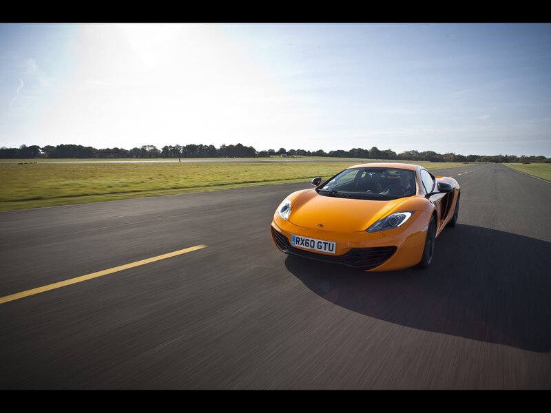 Orange sports car on a runway