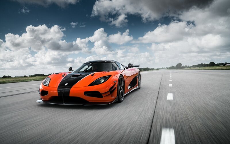 Orange sports car on a runway